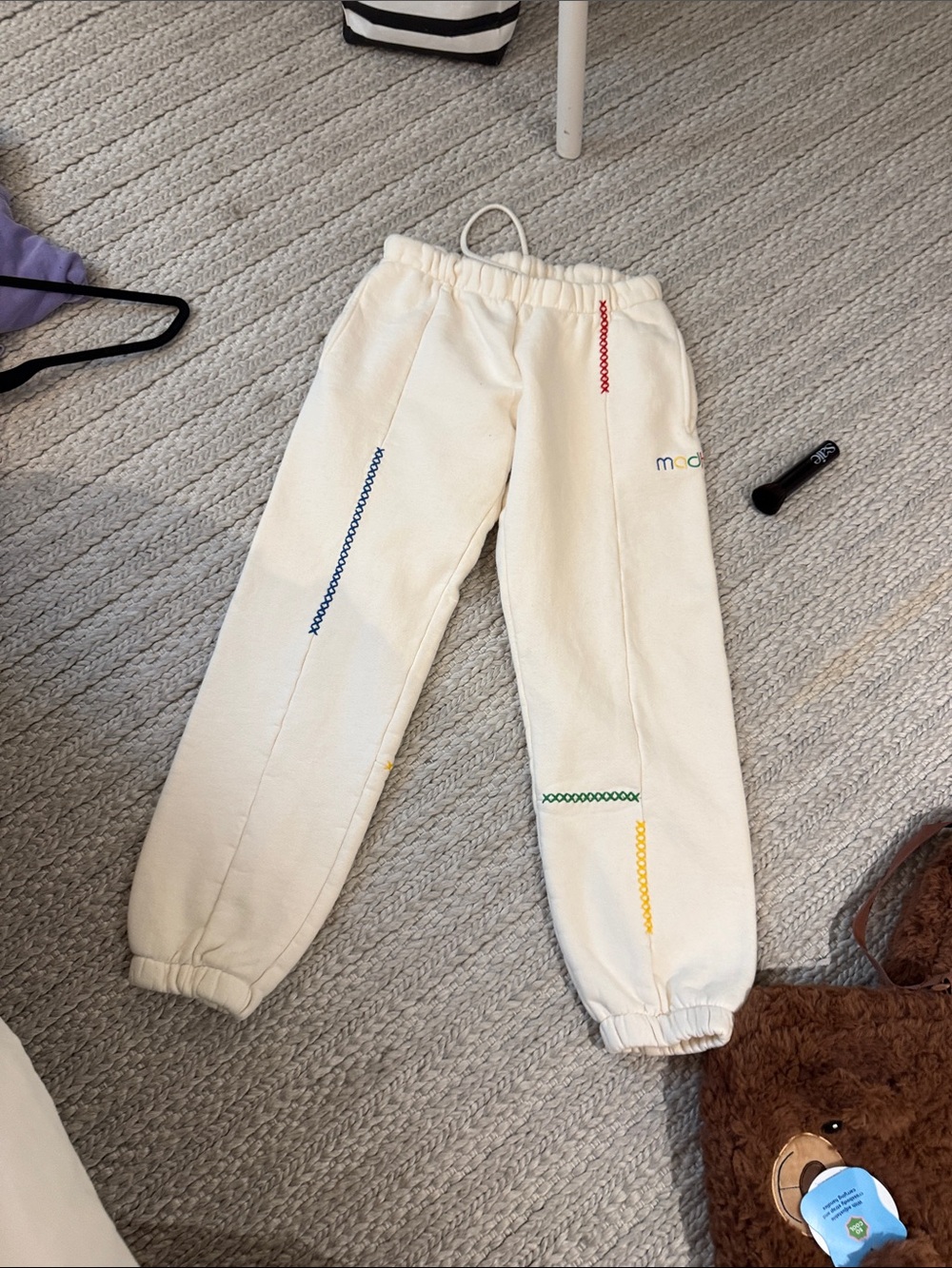 Madhappy Cream Sweatpants with Rainbow Stitch Accents